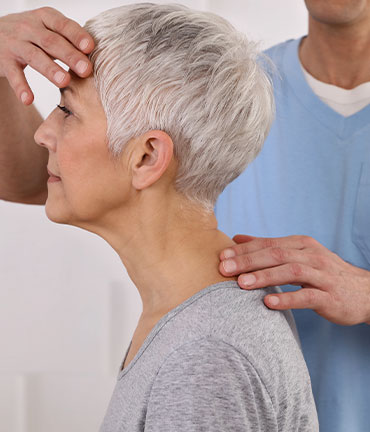 Patient receiving chiropractic adjusmtent for migraine relief from Sandpoint Chiropractors