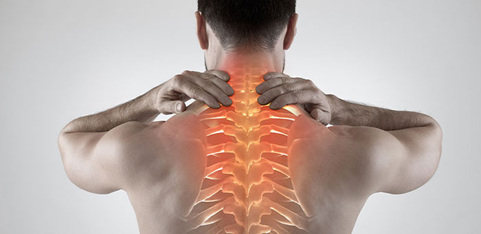 Man with upper back pain before chiropractic treatment from Sandpoint chiropractor